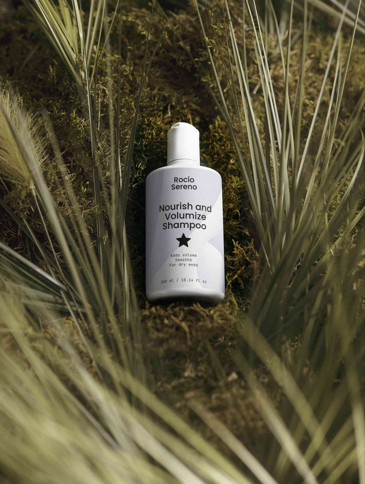 Nourish and Volumize Shampoo bottle with natural ingredients and white packaging for dry ends and volume hair care