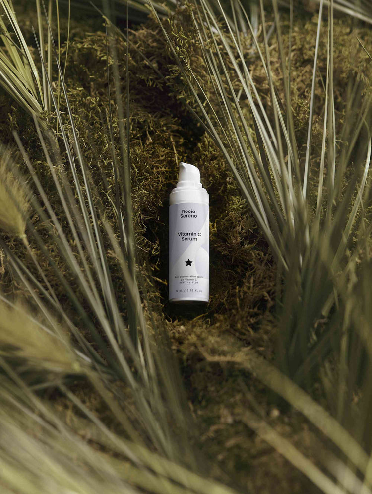 Vitamin C Serum bottle showing 2% natural Vitamin C, Ferulic Acid, and Sea-Buckthorn for radiant, youthful skin protection and hydration.
