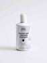 Nourish and Volumize Shampoo bottle with natural ingredients and white packaging for dry ends and volume hair care