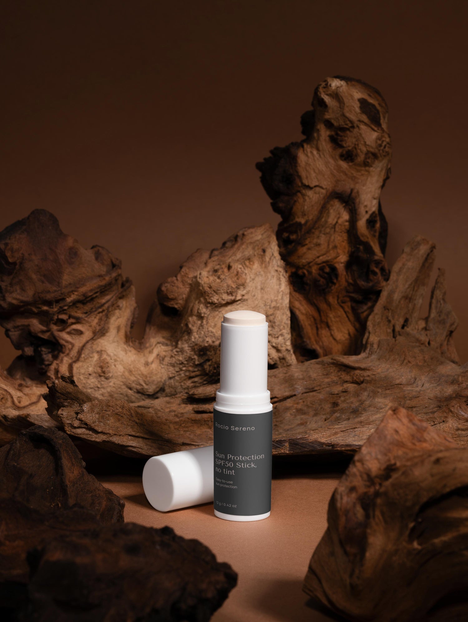 Vegan mineral SPF50 sunscreen stick with clear finish – easy on-the-go sun protection for all skin types.